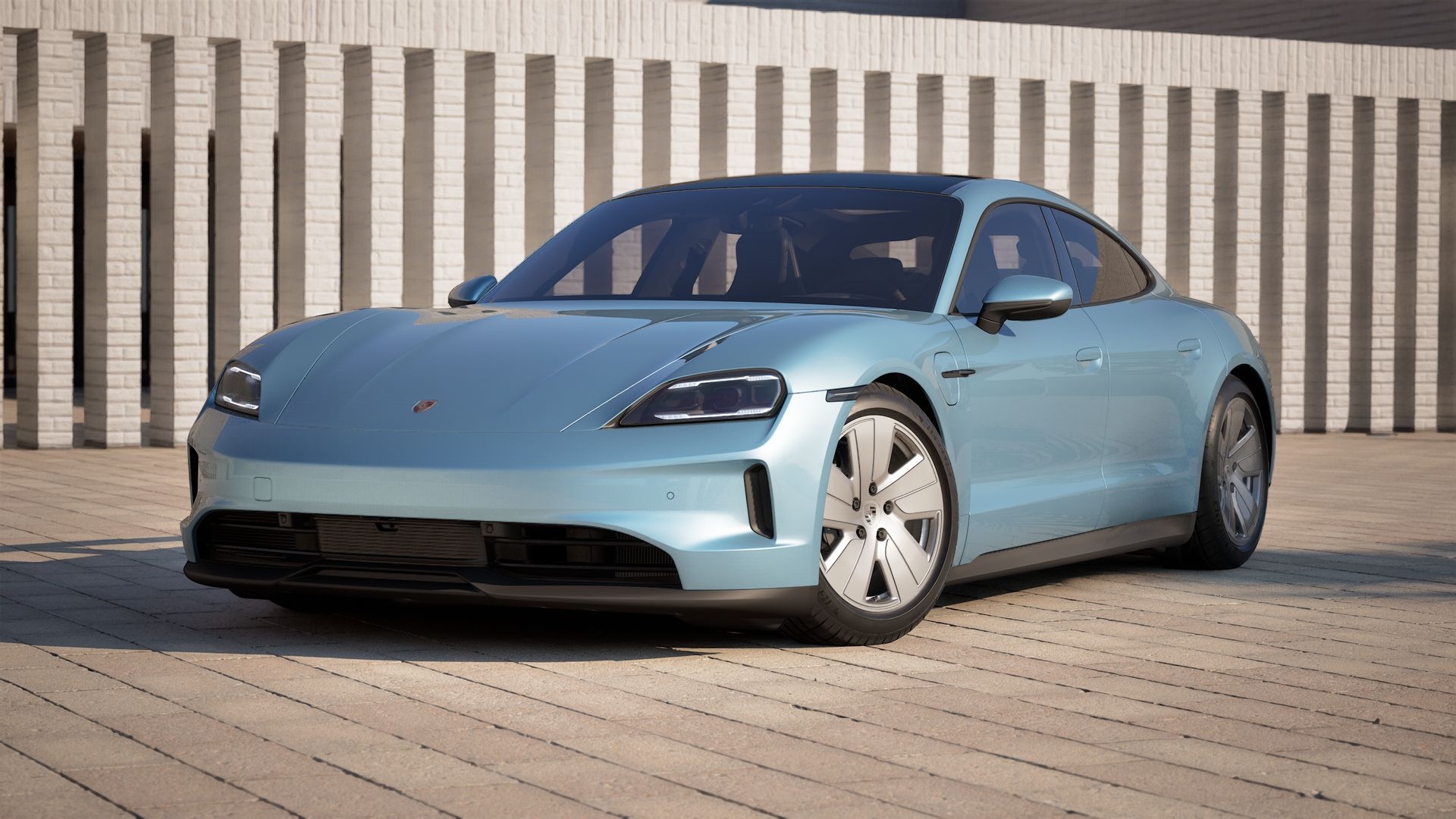 Front view of a light blue Porsche electric sedan parked outdoors