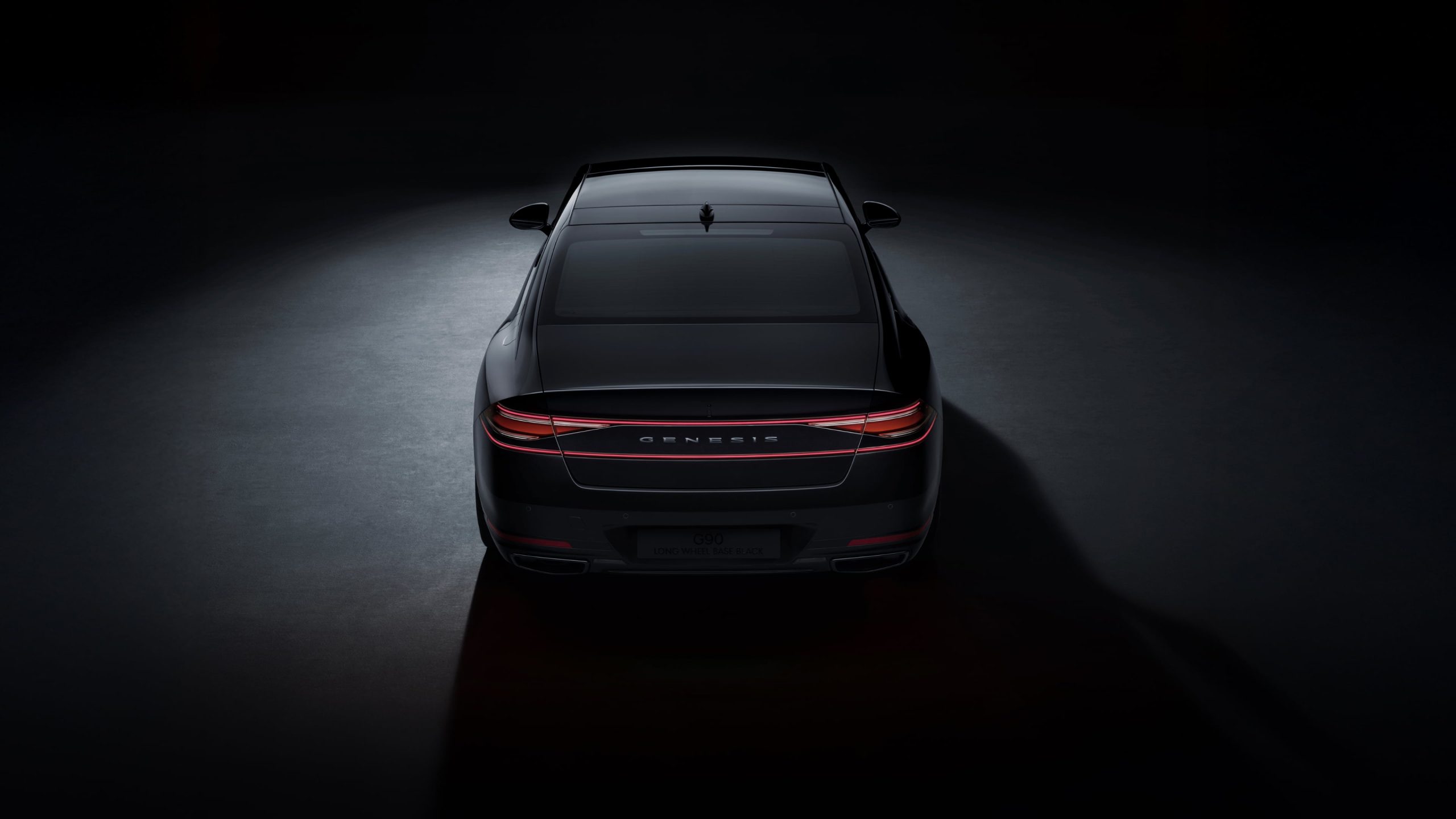 Genesis G90 sedan in matte black back side 