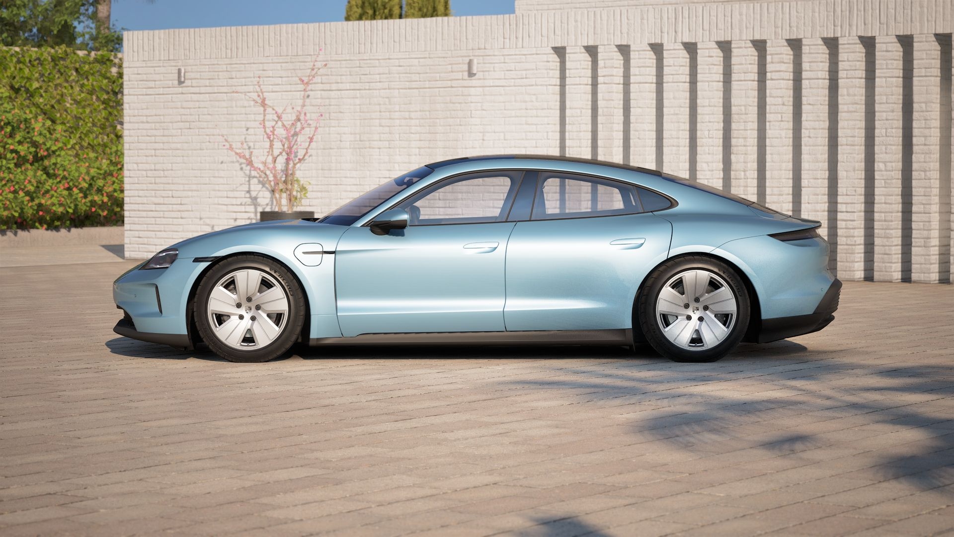 Side profile of a light blue Porsche electric car with sleek aerodynamic design