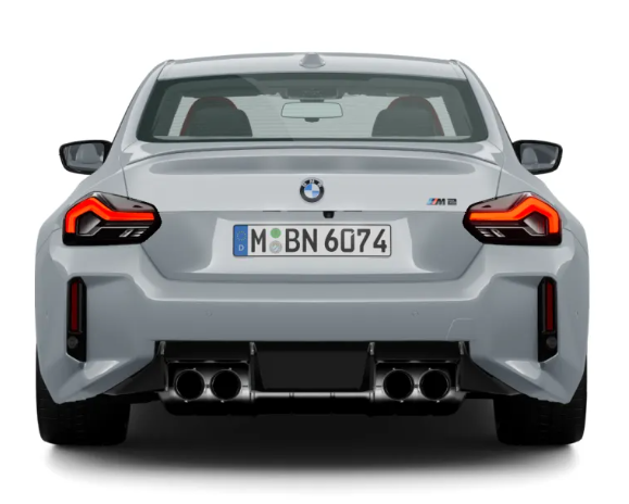 BMW M2 rear view showing quad exhaust system, sculpted bumper, LED taillights, and sporty coupe design.