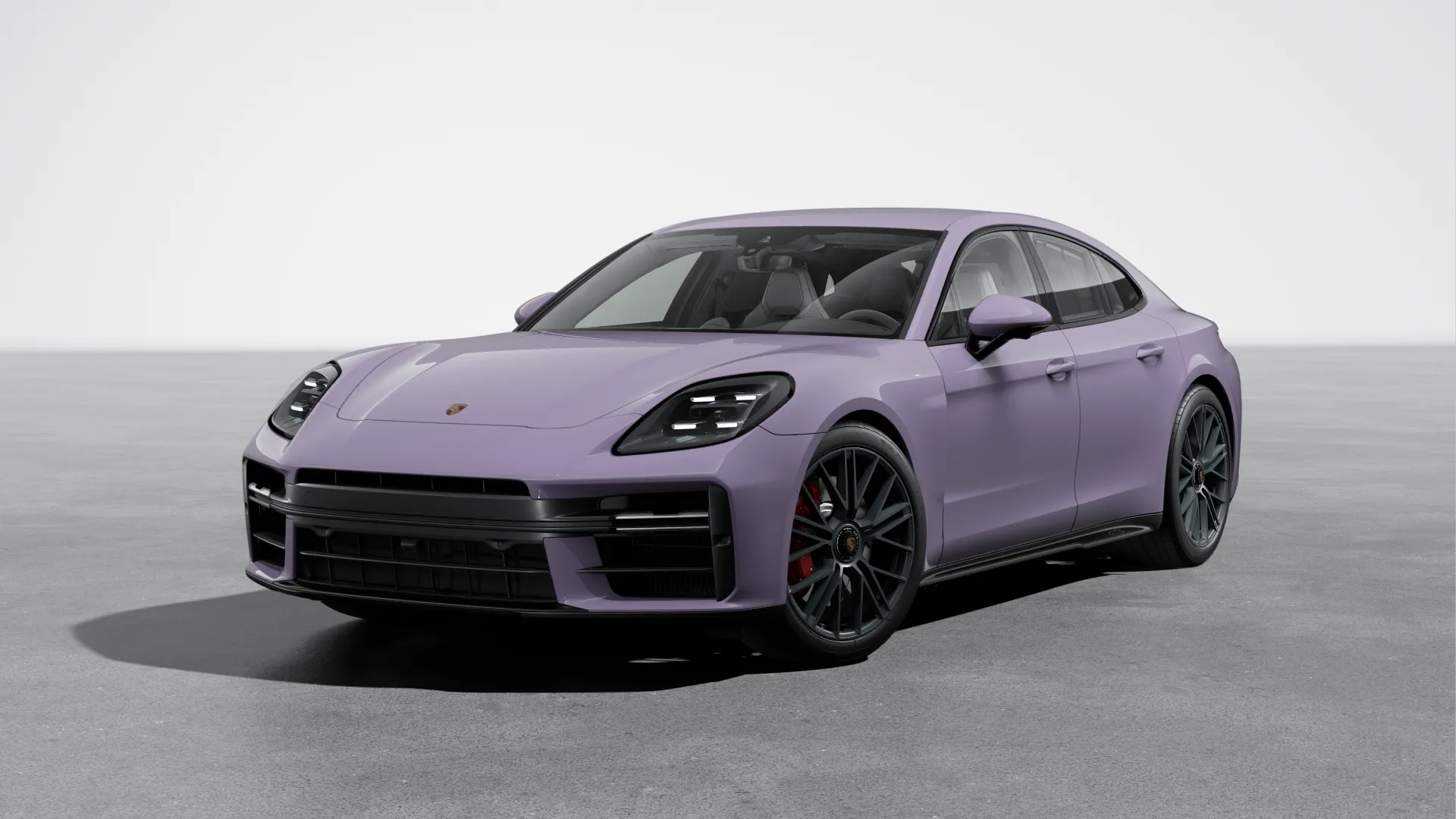 Purple Porsche Panamera sports sedan on a clean grey background, emphasizing its sleek aerodynamic body, luxury performance features, and modern design